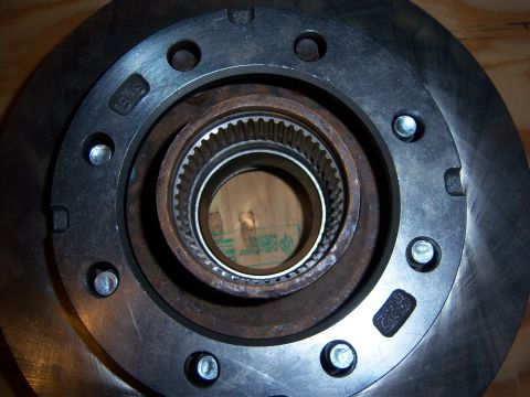1996 Ford Bronco - Close-up view of an 8 lug hub and brake rotor assembly, showing the internal splines and mounting bolt pattern.