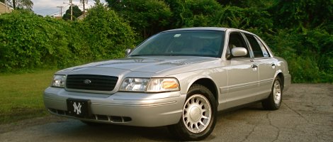 2000 Ford Crown Victoria - This 2000 Ford Crown Victoria is parked outdoors on a sunny day.