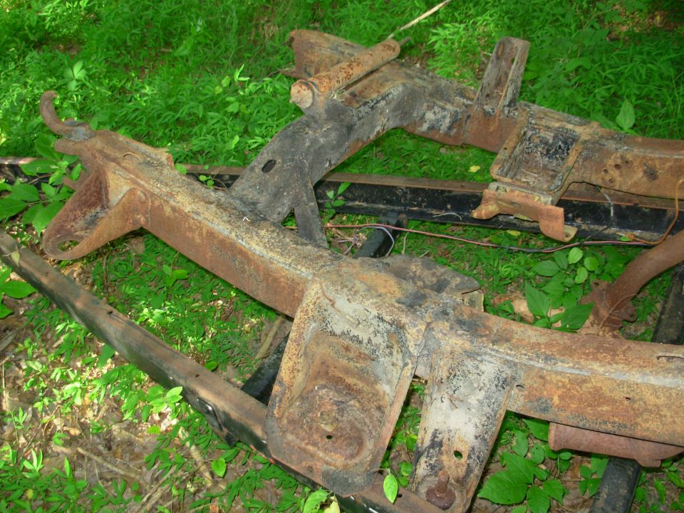 In addition to having several pounds of garbage welded on, the frame horns are substantially bent.