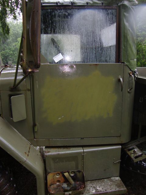 1970 Jeep Commando - The rear window of this truck is covered in water droplets, obscuring the view.