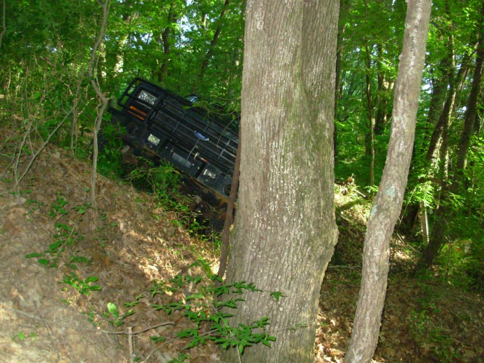 This is a spot I had tried before, and gotten stuck enough for Greg to winch me out from the other side of these trees.  This time, I turned up this steep hill instead.