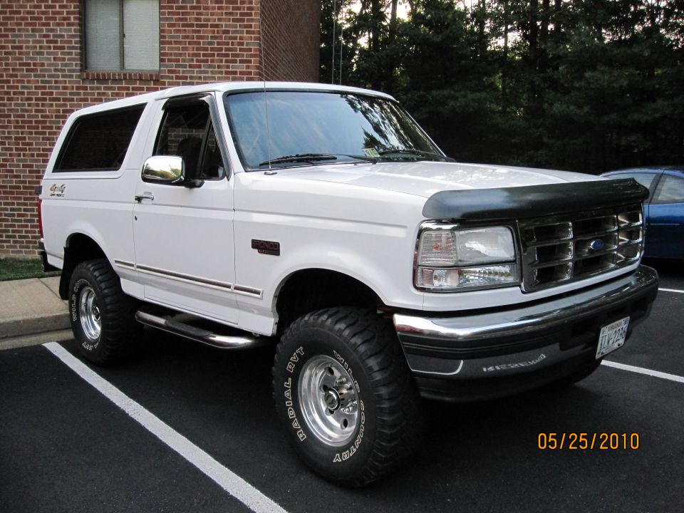 White 1996 Ford Bronco parked in a lot, front 3/4 view