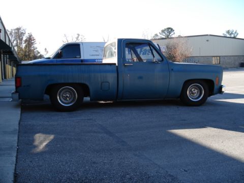 1979 Chevrolet C/K Pickup - Side view of a blue 1979 Chevrolet C/K Pickup with a lowered suspension.