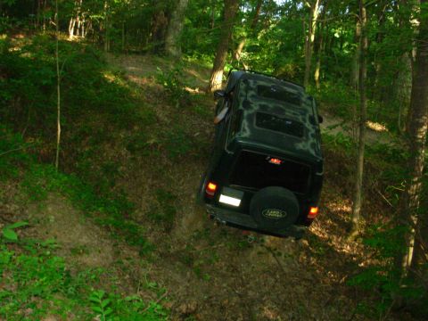 1983 Ford Bronco - I've always told him to exit R of the tree, so he tried it again. But there's a hidden ditch on the R that makes the truck teeter. The LHF…