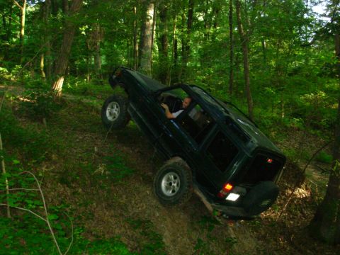 1983 Ford Bronco - This was in the hole during the first attempt to go R of the tree, with the front tire about a foot in the air.