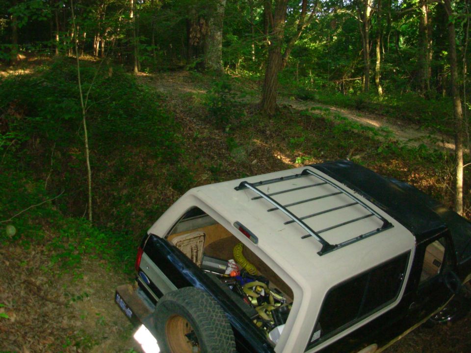 Plowing dirt with the back bumper.
