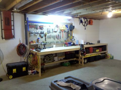 2001 Ford F-150 - A well-organized workbench in a garage or workshop, complete with tools, storage, and lighting.