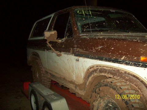 1985 Ford Bronco - This SUV is heavily covered in mud, suggesting off-road use. The date 12/06/2010 is visible.