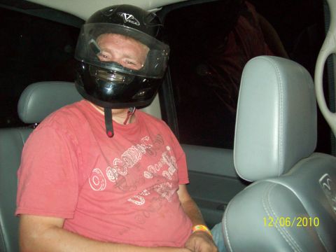 1985 Ford Bronco - Man wearing a helmet inside a vehicle, with a date stamp of 12/06/2010 visible.