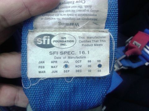 1986 Ford Bronco - Label on a racing harness indicates it meets SFI Spec 16.1 and was manufactured in 1999.