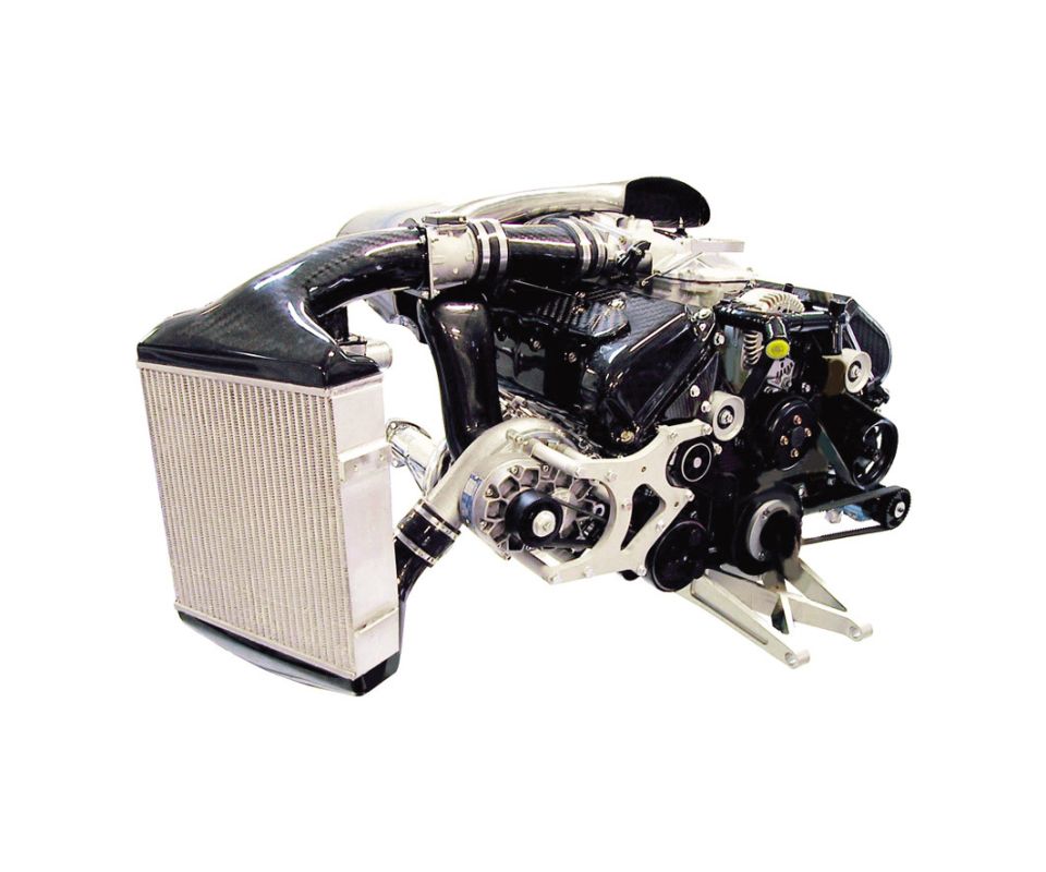 Standalone performance engine with aluminum radiator, carbon intake ducts, and black block with pulleys