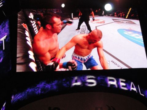 1996 Ford Bronco - A UFC fight is shown on a large screen, with text 'AS REAL' visible at the bottom.