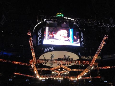 1996 Ford Bronco - A view of the UFC octagon and scoreboard during a fight, with arena lighting illuminating the structure.