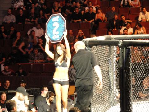 1996 Ford Bronco - A ring girl holds up a sign with the number 2 during a fight event.