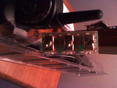 1996 Ford Bronco - Close-up of an electronic circuit board with four connection points and visible part number.