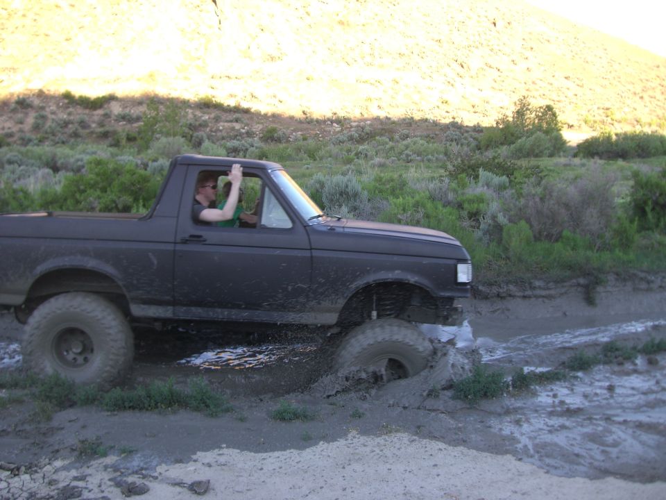 1987 Ford Bronco side view, stuck in mud