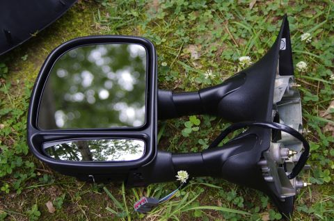 1999 Ford F-250 - Side mirrors, likely for a truck or van, are shown lying on the grass.