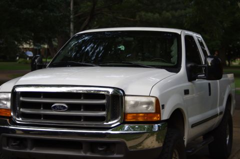 1999 Ford F-250 - This 1999 Ford F-250 pickup truck is shown from a three-quarter front angle.