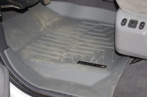 1999 Ford F-250 - Vehicle interior with custom floor mats and power seat controls visible.