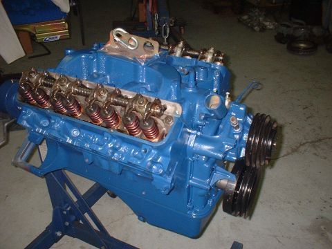 1969 Ford Torino - V8 engine on a stand, valve covers removed to expose internal components.