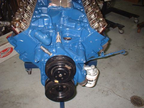 1969 Ford Torino - Engine block painted blue, dual pulleys and an oil filter. Text on the oil filter is partially visible.