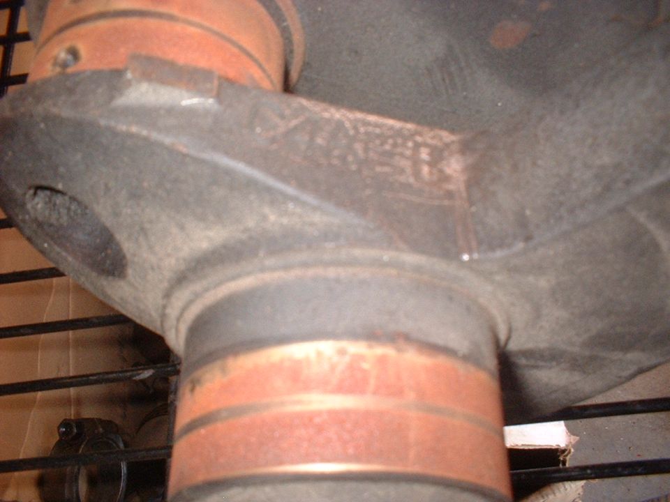 Close-up of a metal part with orange bands