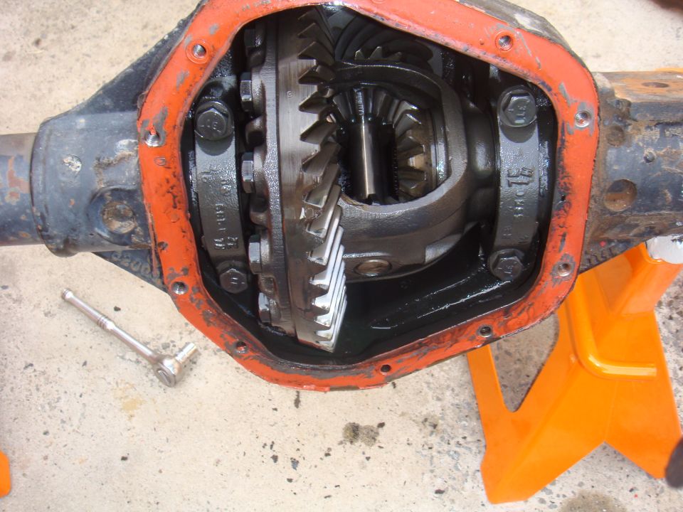 Differential gears with orange gasket and a socket wrench