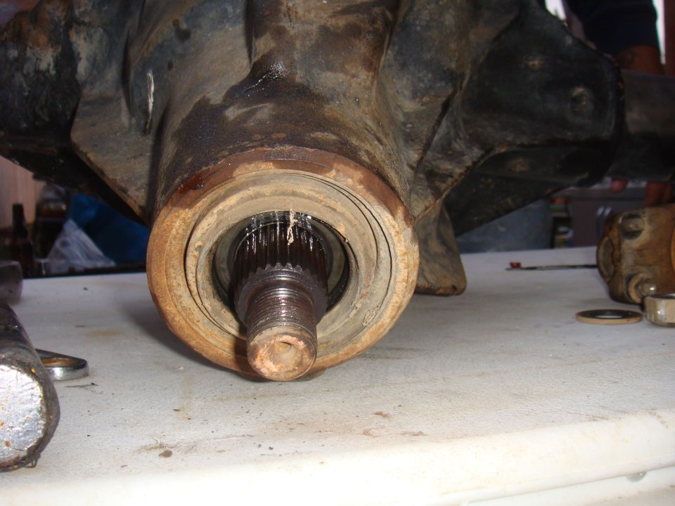 Close-up of a vehicle's front axle hub and spline shaft