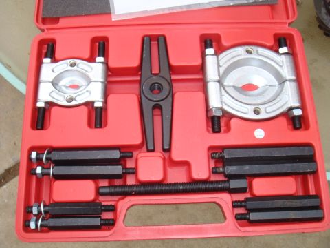 1992 Ford Bronco - A red toolbox contains a bearing separator tool kit with multiple components for mechanical work.