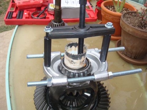 1992 Ford Bronco - Differential gear assembly with a bearing puller tool in use.