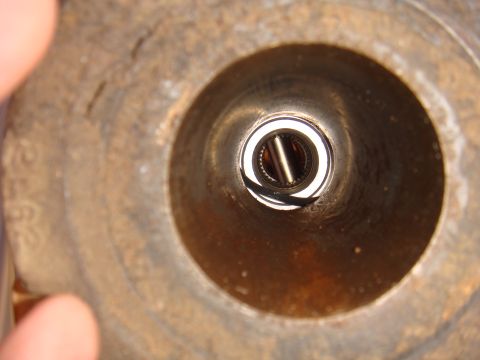 1992 Ford Bronco - A close-up view of a bearing within a metal housing, a watermark from Supermotors.net.