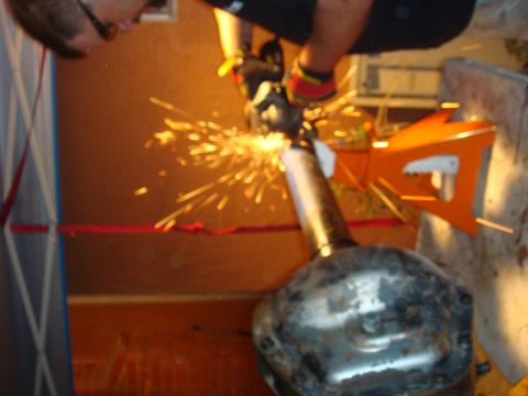 1992 Ford Bronco - Grinding sparks fly as a part of an axle is worked on.