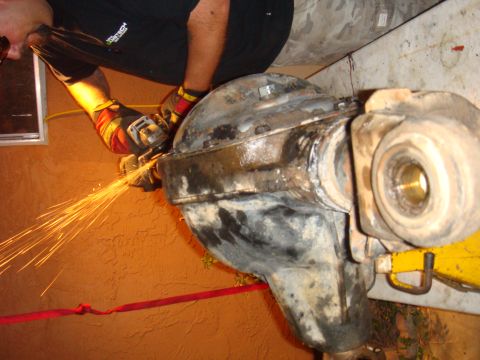 1992 Ford Bronco - Grinding on a differential housing, likely for modification or repair.