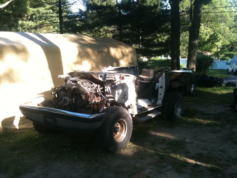 1988 Ford Bronco - This 1988 Ford Bronco is in a state of disassembly, with its engine prominently visible from the front.