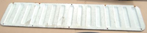 1988 Ford Bronco - A white metal step plate with a ribbed surface is shown, likely a vehicle accessory.