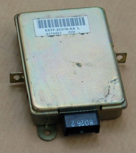 1988 Ford Bronco - This is a Ford electronic control module, identified by the part number E8TF-2C018-AA L and the Ford logo.