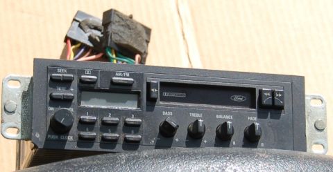 1988 Ford Bronco - A Ford car radio unit with AM/FM tuning and audio controls is shown.