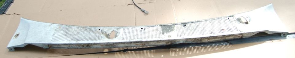 windshield cowl panel with mesh inserts and mounting holes