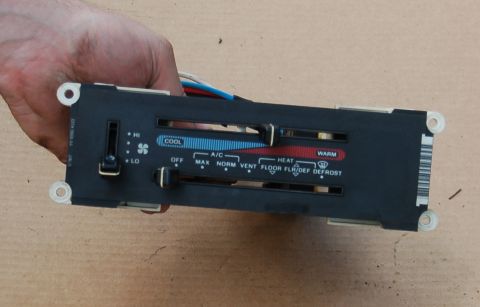 1988 Ford Bronco - This HVAC control panel shows temperature and fan speed sliders, along with mode selection for A/C, heat, and defrost.