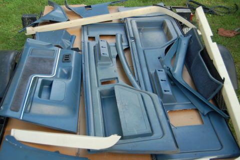1988 Ford Bronco - Collection of blue interior door panels and trim pieces, likely for a Ford Bronco.