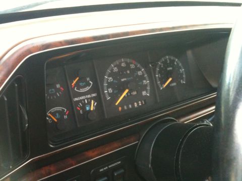 1989 Ford Bronco - The dashboard of a 1987 Ford F-150 shows the speedometer, tachometer, and various other gauges.