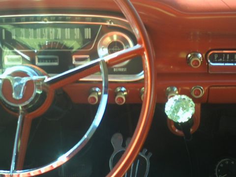 1972 Ford Ranchero - Interior view of a classic car's dashboard, a distinctive steering wheel and shift knob.