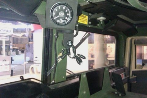 1991 Ford Crown Victoria - The interior of a vehicle is visible, a tachometer and various gauges.
