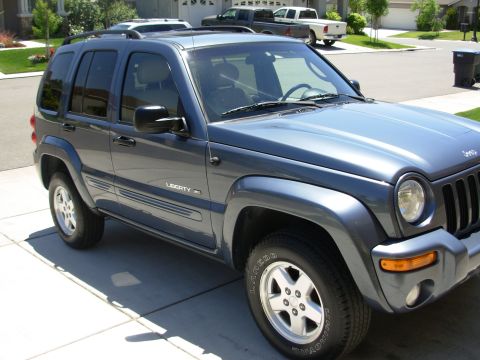 2002 Jeep Liberty - 2002 Jeep Liberty exterior shot, parked on a suburban driveway.