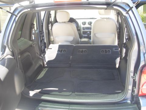2002 Jeep Liberty - The cargo area of a 2002 Jeep Liberty is shown with the rear seats folded flat.
