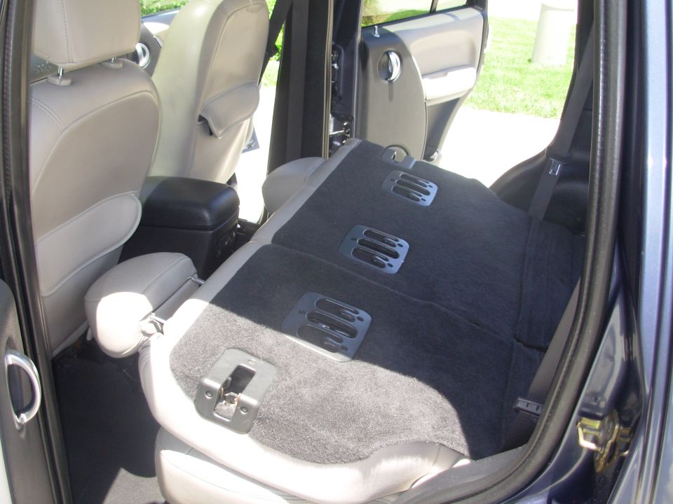 2002 Jeep Liberty interior showing folded rear seat and front seats