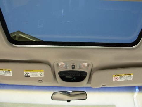 2002 Jeep Liberty - Interior view of a 2002 Jeep Liberty, highlighting the sunroof and overhead console.
