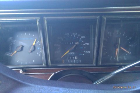 2000 Mercury Grand Marquis - Interior view of a car's dashboard, displaying the speedometer, odometer, fuel gauge, and clock.