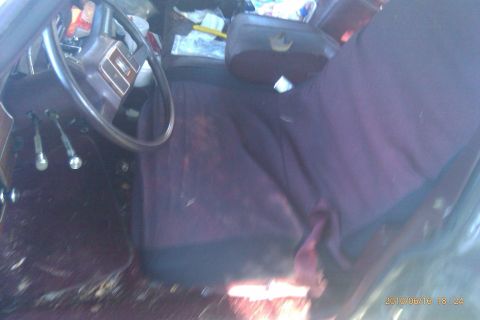 2000 Mercury Grand Marquis - The interior of a car is shown, purple seats and a steering wheel. The registry information does not match the visual evidence.