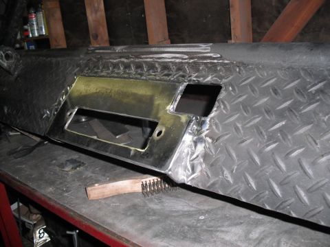1991 Ford Bronco - Custom fabricated metal bumper part, likely for an off-road vehicle, undergoing modification.